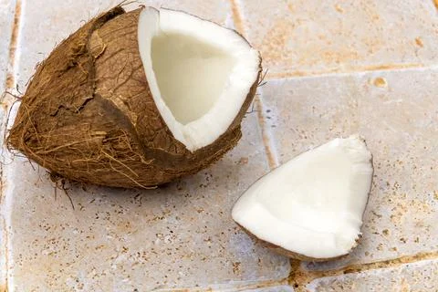 Open fresh coconut isolated on a table Stock Photos