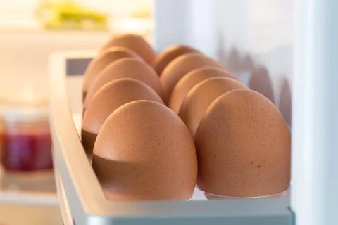 Open fridge filled with eggs Stock Photos