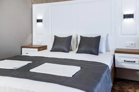 The open front door to the kitchen. White kitchen with wooden countertop and  Stock Photos