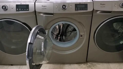 Open Front Load Washer Dryer with Stainless Steel Drum Stock Footage 162999842