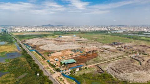Open Garbage Dump Yard On The Edge Of A Growing City Handling Daily Waste Stock Photos