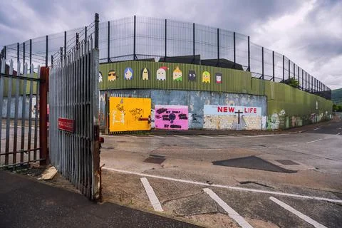 Open gate across the road at one of the Peace Wall in Belfast, Northern Ireland Stock Photos