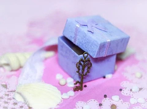 Open gift box with a key Stock Photos