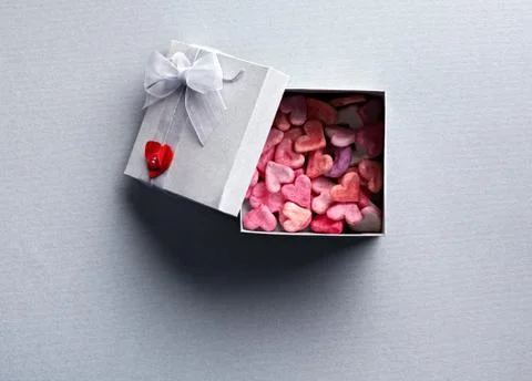 Open gift box with lots of cute little hearts Fotos de archivo