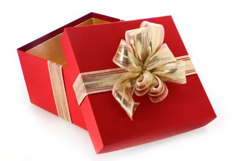 Open gift box with tilted lid and gold bow Stock Photos