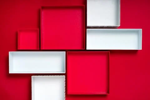 Open gift boxes on red background with copy space Foto stock