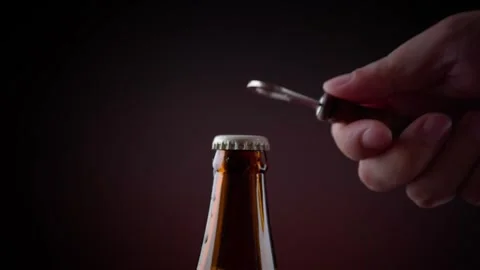 Open glass beer bottle cap Stock Footage 293999130