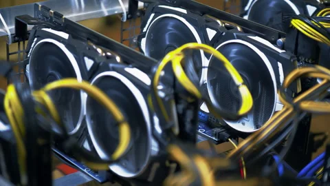 Open GPU mining rig packed with graphics cards fans and power cables Stock Footage 344136409