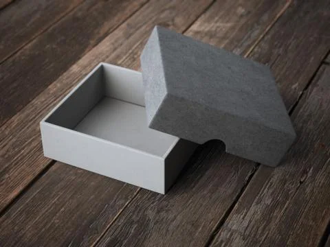 Open gray box on wooden table Illustrazione stock