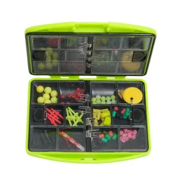 Open green plastic tackle box filled with colorful assorted fishing gear an.. Stock Photos