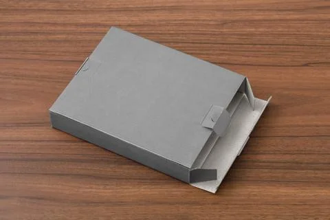 Open grey box packaging mockup on wood table Stock Photos