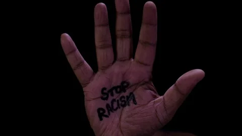 Open Hand has Stop Racism written on it Stock Footage 248781322