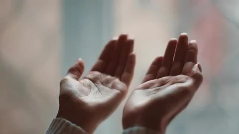Open hands with palms up in a gentle gesture Stock Photos