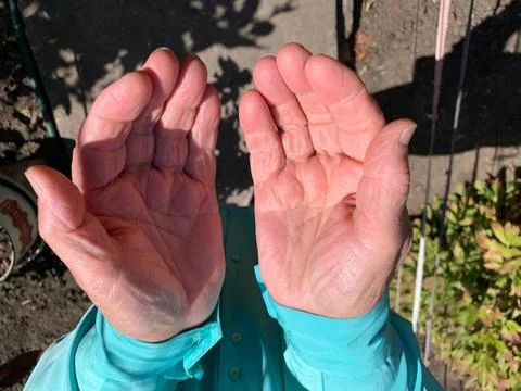 Open hands in prayer gesture Stock Photos
