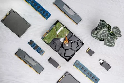 Open hard disk drive with visible platter, RAM modules, SSD, USB flash driv.. Stock Photos