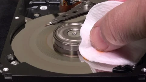 Open hard drive, close-up view, start rotation and delete the word DATA- C00 Stock Footage 320838088
