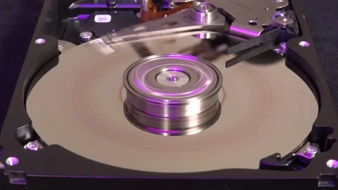Open hard drive, close-up view with colorful light effects, rotation stop on Stock Footage 320838921