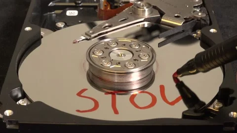 Open hard drive, close-up view with colorful light effects, word STOLEN writ Stock Footage 320839441