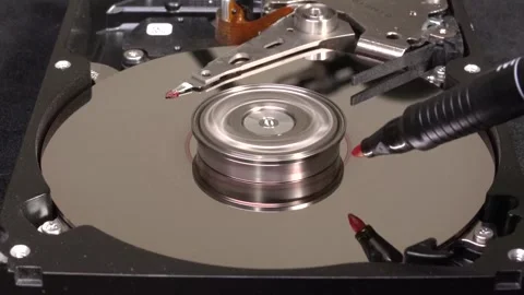 Open hard drive, close-up view, starting rotation and platter coloring - C00 Stock Footage 320839442
