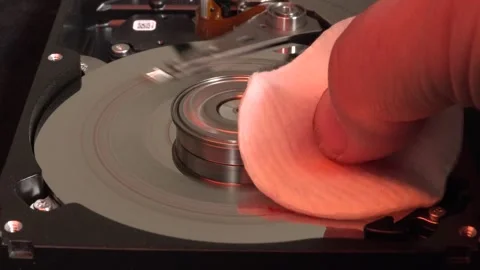 Open Hard Drive, Close-up View, Start Rotation and Erase the Word DATA, with Stock Footage 320839919