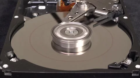 Open hard drive, close-up view, stop spinning, word DATA un-written - C0004R Stock Footage 321247038
