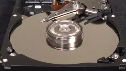 Open hard drive, close-up view, start rotation and un-delete the word DATA - Stock Footage 321247041