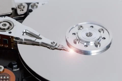 Open hard drive with magnetic disk and writing head Stock Photos