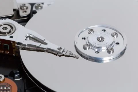 Open hard drive with magnetic disk and writing head Stock Photos