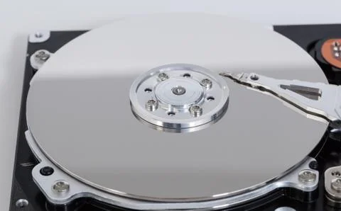 Open hard drive with magnetic disk and writing head Stock Photos