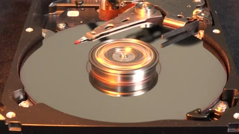 Open hard drive spinning with light effects flashing from left across surfac Stock Footage 320836056
