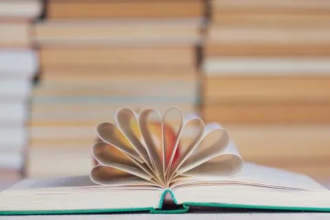 Open hardcover book with the pages collected in the center Stock Photos