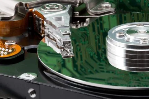 Open harddrive with reflection of a pc circuit board Stock Photos