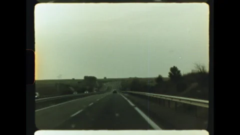 Open highway road trip at dusk through countryside on super 8 Video stock 337800835