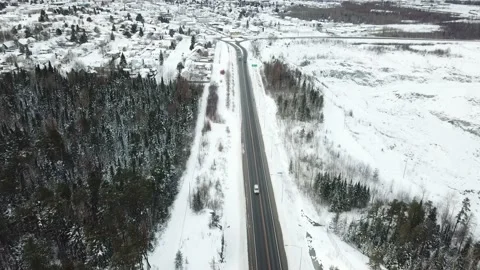 Open highway road in the winter of Canada  - Drone 4k Aerial Stock Footage 144305658