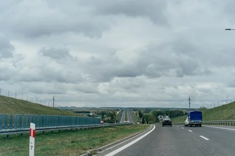 Open Highway Under Cloudy Sky Stock Photos