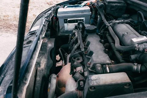 Open hood of the car. View of the engine and vehicle parts. Diagnostics and Fotos de archivo