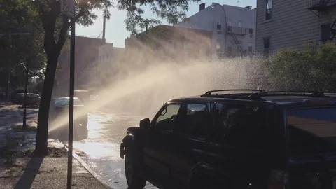 Open Hydrant Spraying Water in New York City Street to Cool Down the Summer Heat Stock Footage 106729791
