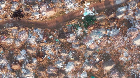 Open illegal dump: abandoned piles of rubble, medical waste and debris on field Stock Footage 145220411