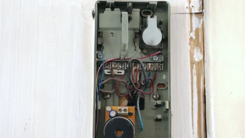 Open intercom broken box with hanging dusted handset, old defective interphone Stock Footage 135412441