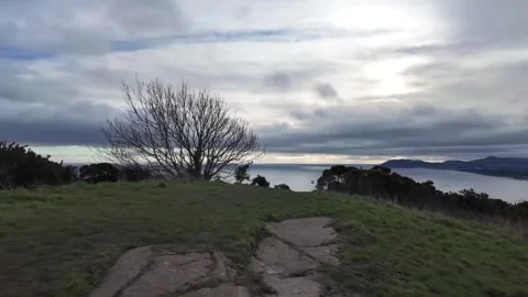 Open Irish Countryside Field Under Dramatic Cloudy Sky Stock Footage 327624901