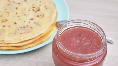 Open a jar of Jam made from fresh strawberries Stock Footage 228713928