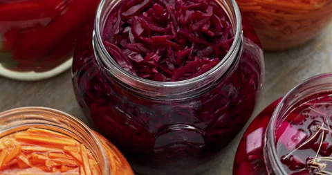 Open jars with lacto-fermented vegetables. Stock Footage 278411298