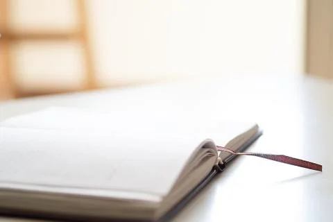 Open journal on a white background Stock Photos