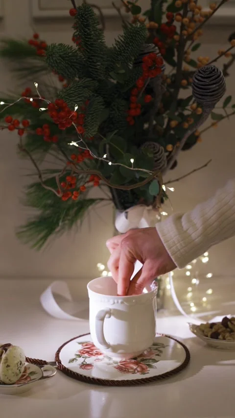 Open the kettle by hand close-up. Decorated christmas tree on background Stock Footage 224895567