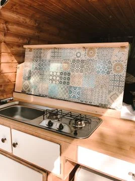 Open kitchen in a camping van - cooking in the open air - vanlife Stock Photos