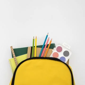 Open knapsack with school accessories . High quality and resolution beautiful Stock Photos