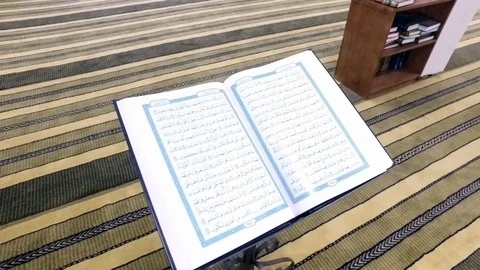 An open Koran in an mosque on an iron stand. Stock-Footage 76569923