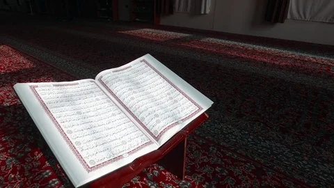 Open the Koran in the Mosque on the Table. Are visible Ayyats. 3 Stock Footage 76246501