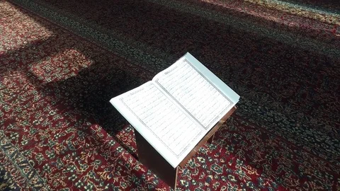 Open the Koran in the Mosque on the Table. Are visible Ayyats. 3 Stock Footage 76246613