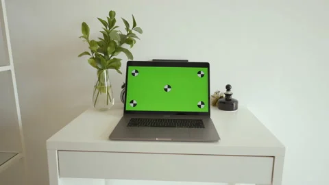 Open laptop with chromakey screen stands on white desk Stock Footage 201238762